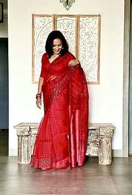 Pure Muslin with all over sequins woven and woven Border - Red Pure Muslin with all over sequins woven and woven Border - Red