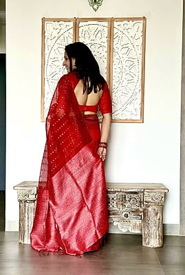 Pure Muslin with all over sequins woven and woven Border - Red Pure Muslin with all over sequins woven and woven Border - Red
