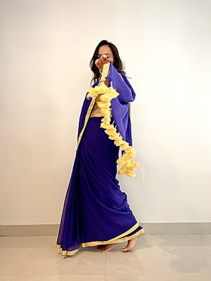 PURPLE MUL COTTON PLAIN SAREE WITH YELLOW INCH BORDER AND POMPOMS ON PALLU PURPLE MUL COTTON PLAIN SAREE WITH YELLOW INCH BORDER AND POMPOMS ON PALLU